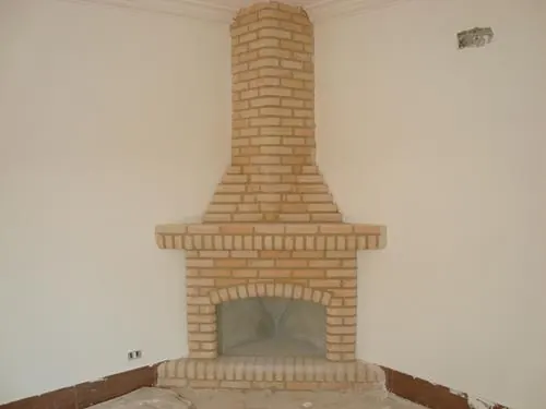 Lareira de tijolo à vista de canto